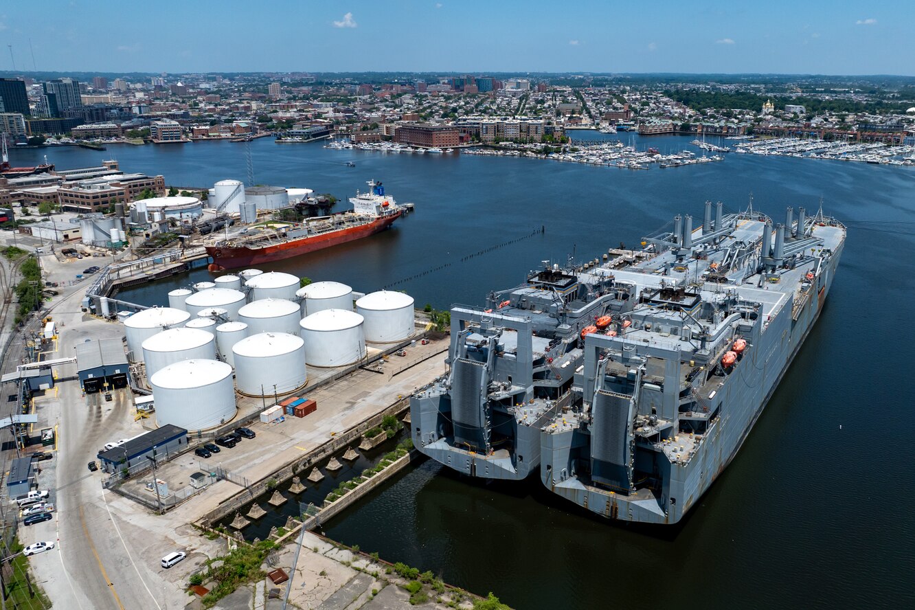 A pair of huge Navy ships, the USNS Charlton, left, and the USNS Pomeroy, are docked near residential homes at North Locust Point on June 5.